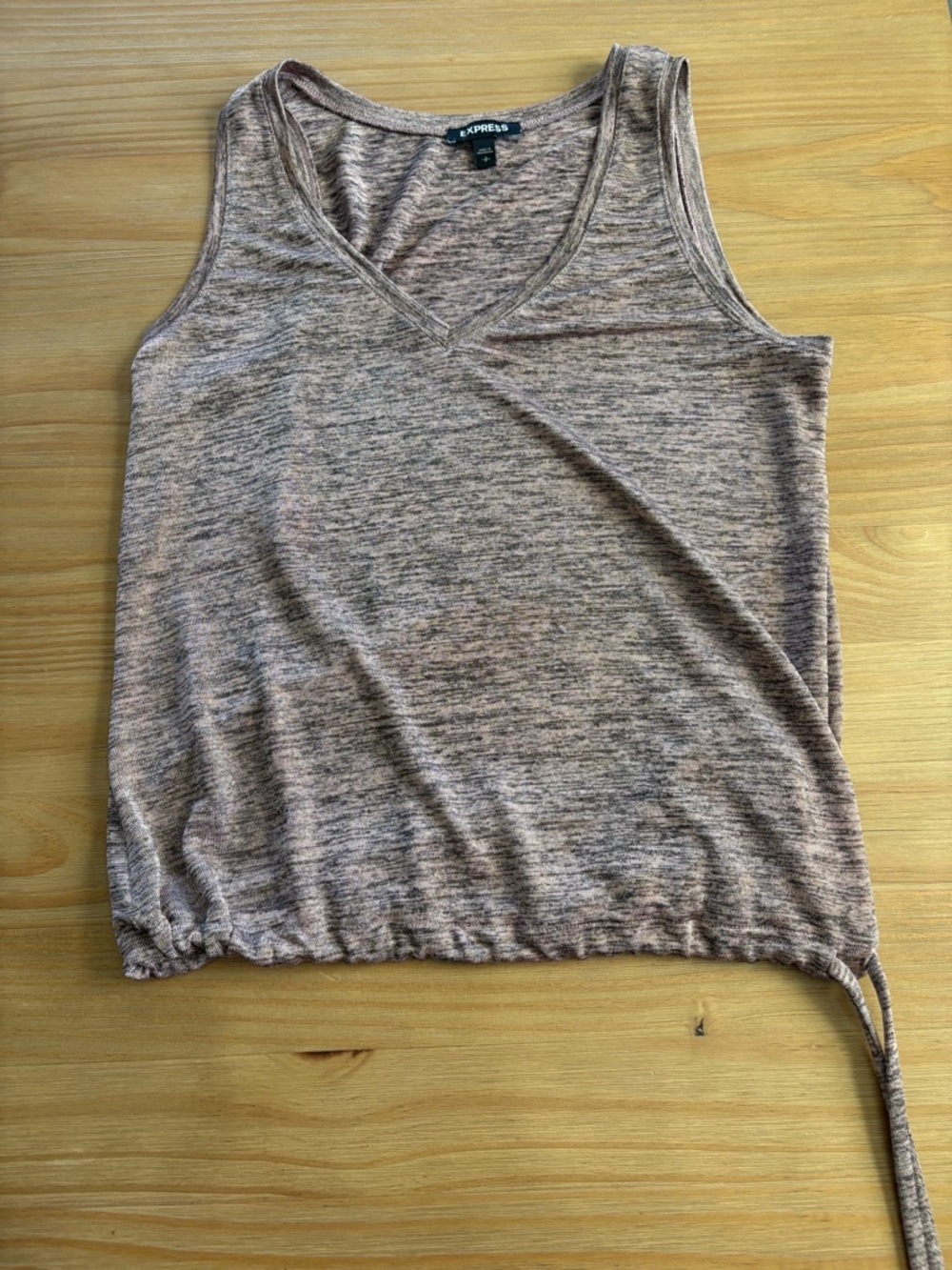 Express tank size small. Ties on side. Cute with shorts